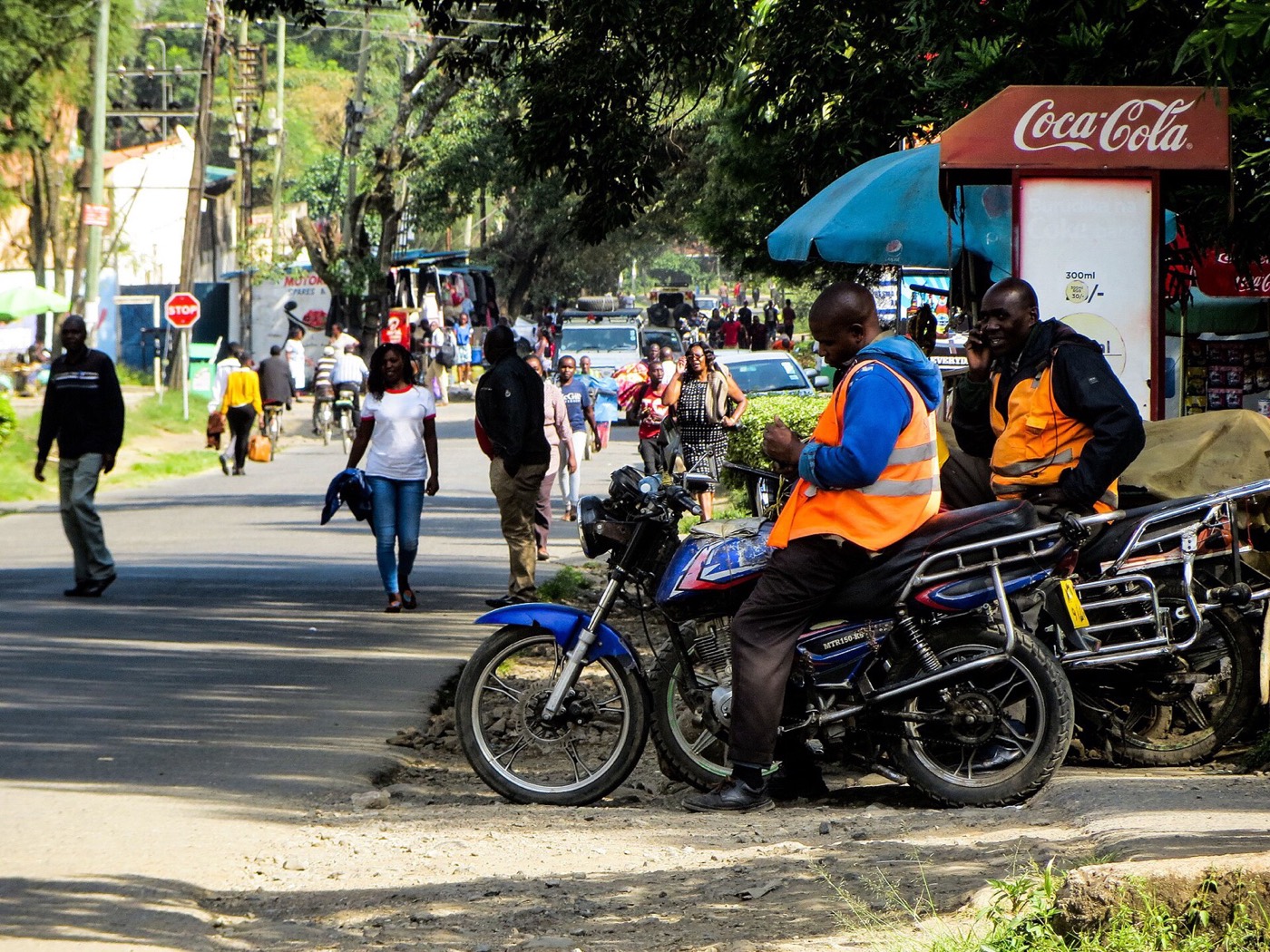 Boda boda riders waiting for customers at a stage