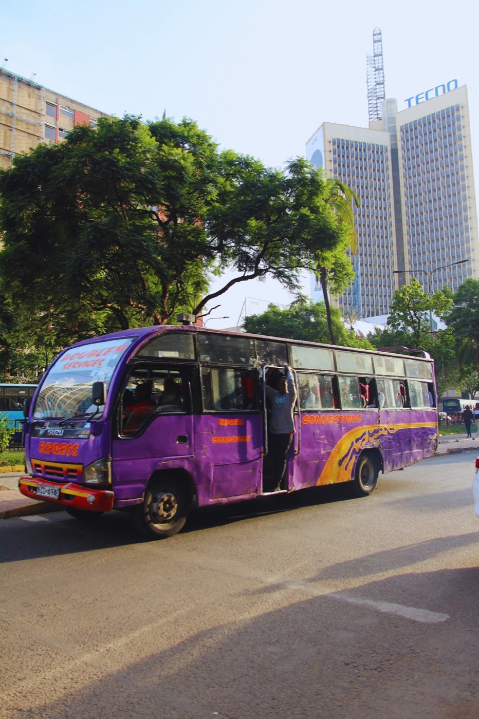 A brightly painted matatu in Nairobi traffic at rush hour