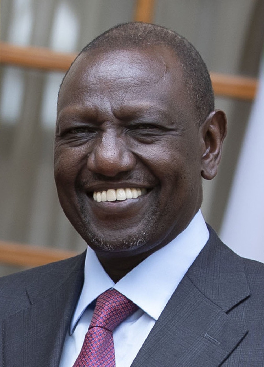 President William Ruto in a dark suit at an official engagement